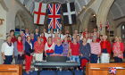 34 choir members, MD William Thomas and accompanist Alison Ashby