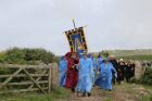 The procession leading towards the stone circle of the Mann family